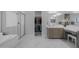Bathroom with a large soaking tub, glass shower, and a walk-in closet at 22670 E Russet Rd, Queen Creek, AZ 85142