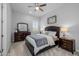 Bedroom with plush carpet, dark wood furniture, and soft lighting, creating a cozy retreat at 22670 E Russet Rd, Queen Creek, AZ 85142