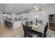 View of the dining room and kitchen with stainless appliances and a large island at 22670 E Russet Rd, Queen Creek, AZ 85142