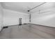 Spacious garage with epoxy flooring, ample lighting, and clean, organized space for vehicles and storage at 22670 E Russet Rd, Queen Creek, AZ 85142