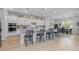 Bright kitchen featuring an island with seating, modern appliances, and direct access to the dining room at 22670 E Russet Rd, Queen Creek, AZ 85142