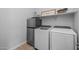 Laundry room featuring modern appliances, ample storage, and a practical layout for convenience at 22670 E Russet Rd, Queen Creek, AZ 85142