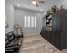 Relaxing living room with a comfortable leather couch, built-in shelving, and a serene atmosphere at 22670 E Russet Rd, Queen Creek, AZ 85142