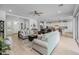 Spacious living area with a seamless transition to the kitchen, featuring comfortable sofas and stylish accents at 22670 E Russet Rd, Queen Creek, AZ 85142