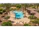 Close-up of a sparkling community swimming pool with lounge chairs and a shaded seating area at 22670 E Russet Rd, Queen Creek, AZ 85142