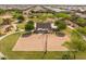 Aerial view of a community park with a shaded picnic area and sand volleyball court at 22670 E Russet Rd, Queen Creek, AZ 85142