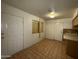 Eat-in kitchen with tile floors, light cabinets, and laminate countertops at 2328 W Lupine Ave, Phoenix, AZ 85029