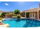 Resort-style backyard with a pool, pergola, and lush landscaping, perfect for outdoor living at 23829 N 59Th Dr, Glendale, AZ 85310