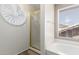 Bright bathroom featuring a luxurious soaking tub and separate glass-enclosed shower at 23829 N 59Th Dr, Glendale, AZ 85310