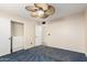 Comfortable bedroom with ceiling fan and closet at 23829 N 59Th Dr, Glendale, AZ 85310