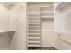 Walk-in closet with built-in shelving and ample storage space at 23829 N 59Th Dr, Glendale, AZ 85310