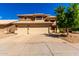 Charming two-story home with a three-car garage and a well-maintained yard with mature landscaping at 23829 N 59Th Dr, Glendale, AZ 85310