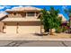 Charming two-story home with a three-car garage and a well-maintained yard with mature landscaping at 23829 N 59Th Dr, Glendale, AZ 85310