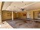 Spacious garage with an automatic door and built-in wooden cabinetry for organized storage at 23829 N 59Th Dr, Glendale, AZ 85310