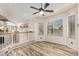 Bright room features a ceiling fan and large windows that provide natural light and backyard views at 23829 N 59Th Dr, Glendale, AZ 85310