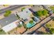 Aerial shot of home with backyard pool, patio, and lush greenery in a quiet residential neighborhood at 2410 N 40Th St, Phoenix, AZ 85008