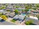 Aerial view of a residential neighborhood featuring a home with a backyard pool and mature trees at 2410 N 40Th St, Phoenix, AZ 85008