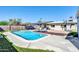 Backyard with a pool, two hanging chairs, and a gazebo at 2410 N 40Th St, Phoenix, AZ 85008