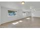 Spacious finished basement with neutral flooring, natural light, and ample room for activities at 2410 N 40Th St, Phoenix, AZ 85008