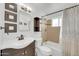 Bathroom featuring a single sink vanity, framed mirror, and shower-over-tub combination at 2410 N 40Th St, Phoenix, AZ 85008