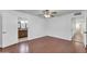Bedroom with wood laminate flooring, ceiling fan, and open doorways at 2410 N 40Th St, Phoenix, AZ 85008