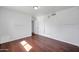 Bedroom with wood laminate flooring, basketball hoop, and sliding door closet at 2410 N 40Th St, Phoenix, AZ 85008