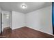 Bedroom with wood laminate flooring and an open doorway with an alcove at 2410 N 40Th St, Phoenix, AZ 85008