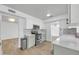 Modern kitchen with stainless steel appliances, white cabinets and sleek countertops at 2410 N 40Th St, Phoenix, AZ 85008