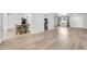 Spacious open-concept living room featuring modern wood-look flooring and ample lighting at 2410 N 40Th St, Phoenix, AZ 85008