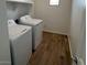 Laundry room with side-by-side washer and dryer at 25351 W Bowker St, Buckeye, AZ 85326
