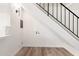 Basement under staircase showing laundry hookups and LVP flooring at 2625 W Ocotillo Rd # 4, Phoenix, AZ 85017