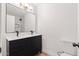 Modern bathroom with a double vanity, a large mirror, and a walk-in shower at 2625 W Ocotillo Rd # 4, Phoenix, AZ 85017