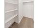 A well-organized closet featuring ample shelving and carpeted floor at 2625 W Ocotillo Rd # 4, Phoenix, AZ 85017