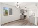 Bright dining area featuring a modern light fixture and a large window for natural light at 2625 W Ocotillo Rd # 4, Phoenix, AZ 85017