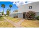 Beautiful building featuring a well-kept lawn, walkway, and vibrant flowering bushes at 2625 W Ocotillo Rd # 4, Phoenix, AZ 85017