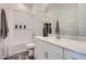 Modern bathroom with white cabinets, quartz countertop, and tub with shower at 2912 E Lucky Horseshoe Ln, San Tan Valley, AZ 85140