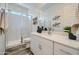 Bathroom with a white vanity, a clear mirror, and a glass shower with white marble wall at 2912 E Lucky Horseshoe Ln, San Tan Valley, AZ 85140