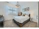 Cozy bedroom with carpeted floors, natural light from the windows, and modern, decorative accents at 2912 E Lucky Horseshoe Ln, San Tan Valley, AZ 85140