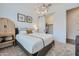 This bedroom showcases a comfortable bed, sliding closet door, and modern light fixture at 2912 E Lucky Horseshoe Ln, San Tan Valley, AZ 85140