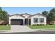 Charming home with a two-car garage, a single car garage and desert landscaping at 2912 E Lucky Horseshoe Ln, San Tan Valley, AZ 85140