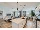 Open concept kitchen featuring a large island, stainless steel appliances, and open floor plan at 2912 E Lucky Horseshoe Ln, San Tan Valley, AZ 85140