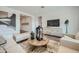 Cozy living room featuring neutral décor, comfortable seating, and a round coffee table at 2912 E Lucky Horseshoe Ln, San Tan Valley, AZ 85140