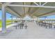Large ramada with metal roof and many picnic tables for community gatherings at 2912 E Lucky Horseshoe Ln, San Tan Valley, AZ 85140