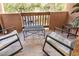 Cozy balcony with tiled flooring, patio chairs, and a tranquil setting with a lush green view at 3031 N Civic Center Plz # 340, Scottsdale, AZ 85251