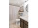 Bathroom featuring a shower and tub combo, neutral tile floor, and stylish vanity with light countertops at 3031 N Civic Center Plz # 340, Scottsdale, AZ 85251