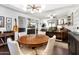 Open-concept dining and living area with stylish lighting, wet bar, and comfortable furnishings at 3031 N Civic Center Plz # 340, Scottsdale, AZ 85251