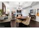 Cozy dining area featuring a modern chandelier, and views into the adjacent kitchen at 3031 N Civic Center Plz # 340, Scottsdale, AZ 85251