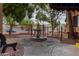 Community water fountain surrounded by trees and a black iron fence at 3031 N Civic Center Plz # 340, Scottsdale, AZ 85251