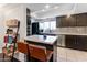 Bright kitchen with subway tile backsplash, modern appliances, and a functional breakfast bar at 3031 N Civic Center Plz # 340, Scottsdale, AZ 85251