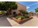 Landscaped area with decorative rocks and lush greenery set amidst well-maintained community buildings at 3031 N Civic Center Plz # 340, Scottsdale, AZ 85251